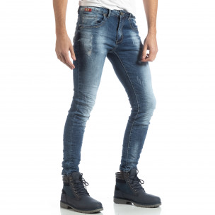 Blugi pentru bărbați albaștri Slim fit cu rupturi decorative - FASHIONMIX.RO Blugi pentru bărbați albaștri Slim fit cu rupturi decorative