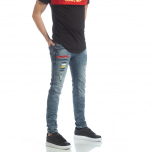 Blugi de bărbați albaștri cu pete colorate - FASHIONMIX.RO Blugi de bărbați albaștri cu pete colorate